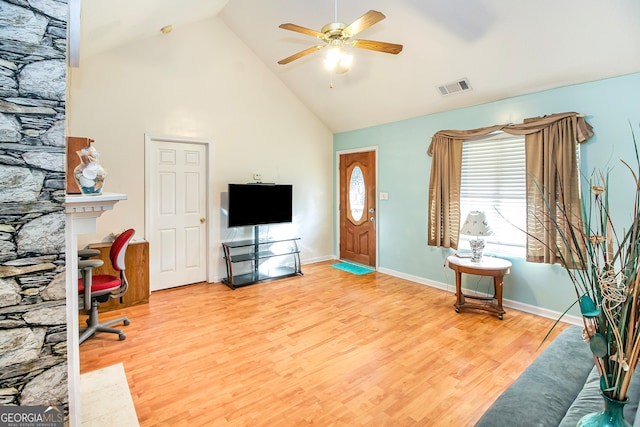 living room featuring high vaulted ceiling, wood-type flooring, and ceiling fan