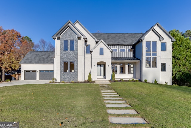 view of front of home featuring a front yard and a garage