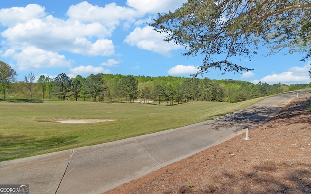 surrounding community featuring a yard