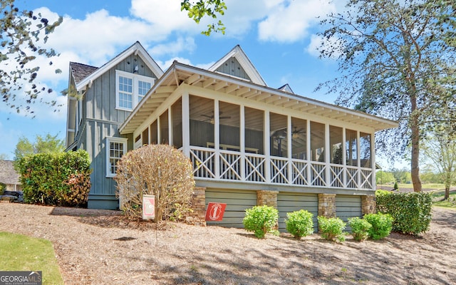 view of front of home featuring a sunroom