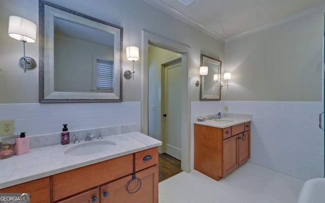 bathroom with tile walls, vanity, tile patterned floors, and crown molding