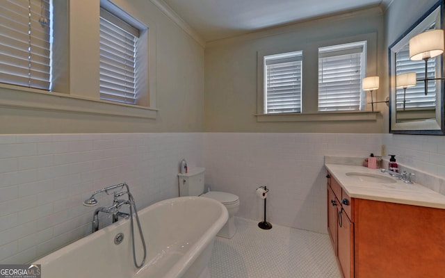 bathroom featuring toilet, tile patterned flooring, tile walls, and a tub to relax in