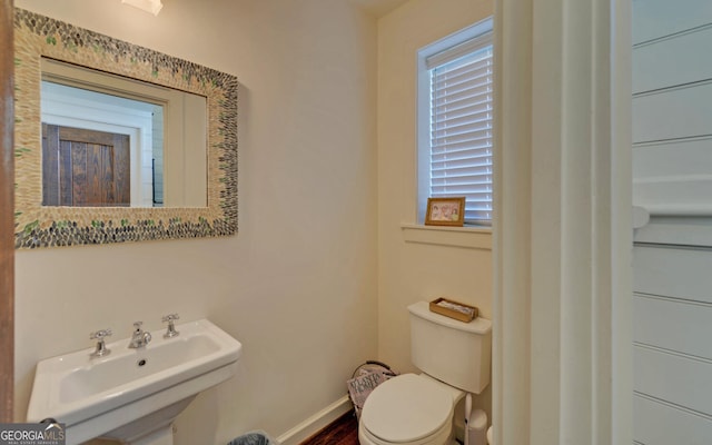 bathroom with sink and toilet