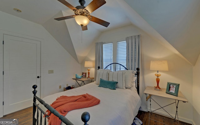 bedroom with lofted ceiling, ceiling fan, and dark hardwood / wood-style flooring