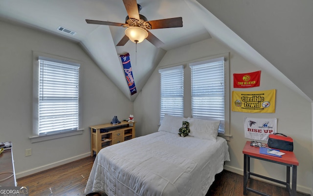 bedroom featuring ceiling fan, vaulted ceiling, and dark wood-type flooring