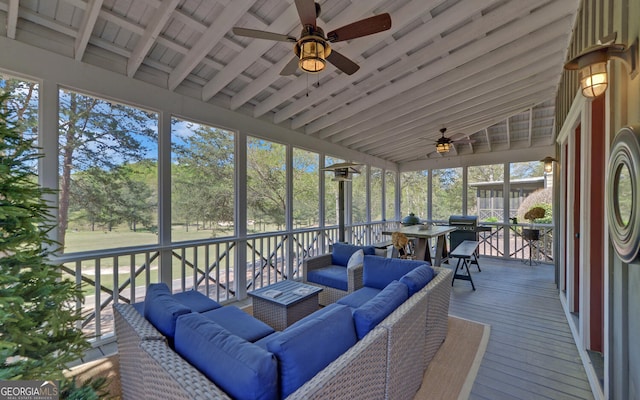 sunroom featuring ceiling fan