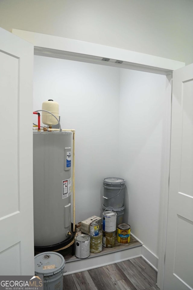 utility room with electric water heater