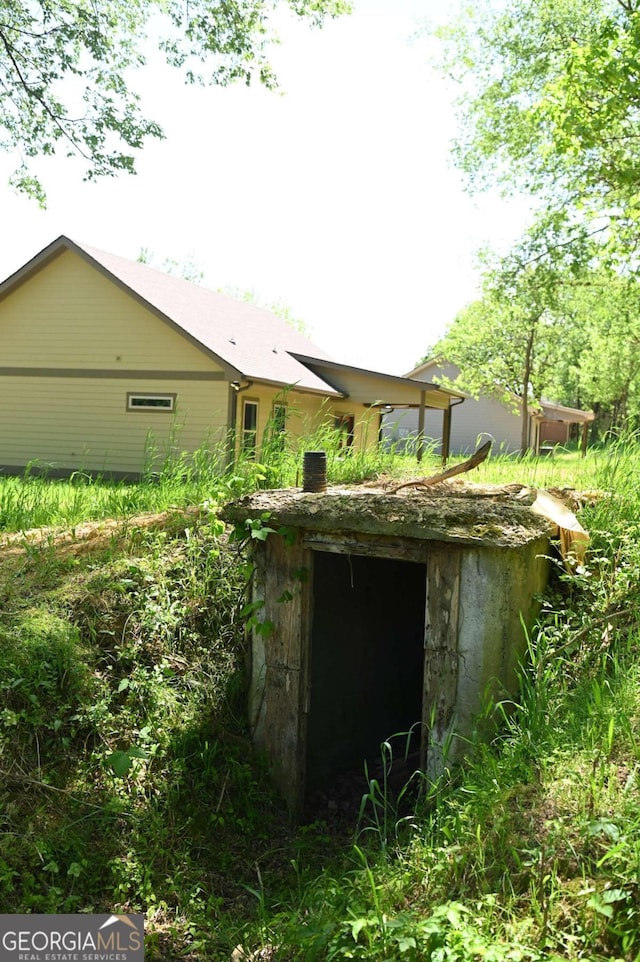 view of entry to storm shelter