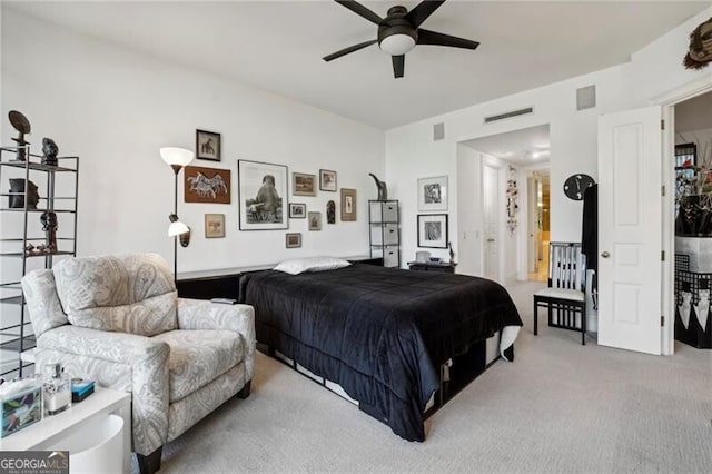 bedroom with ceiling fan and carpet floors