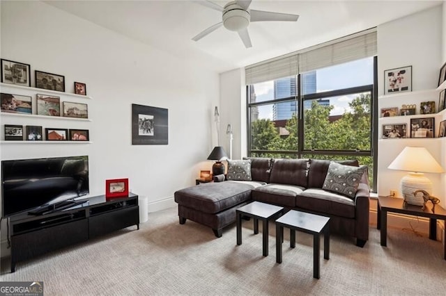 living room featuring carpet flooring and ceiling fan