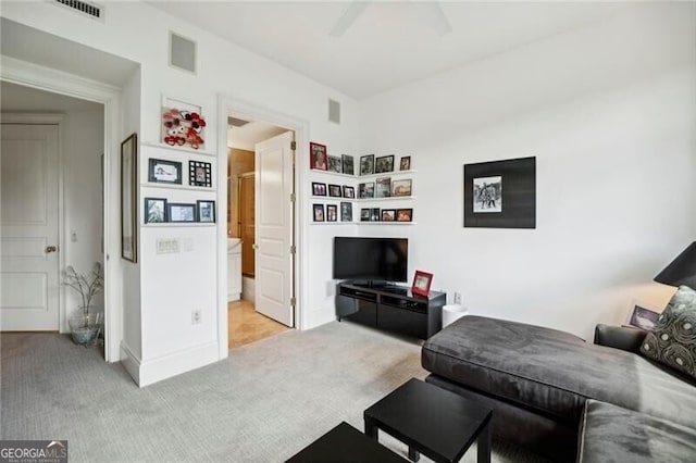 living room featuring light carpet