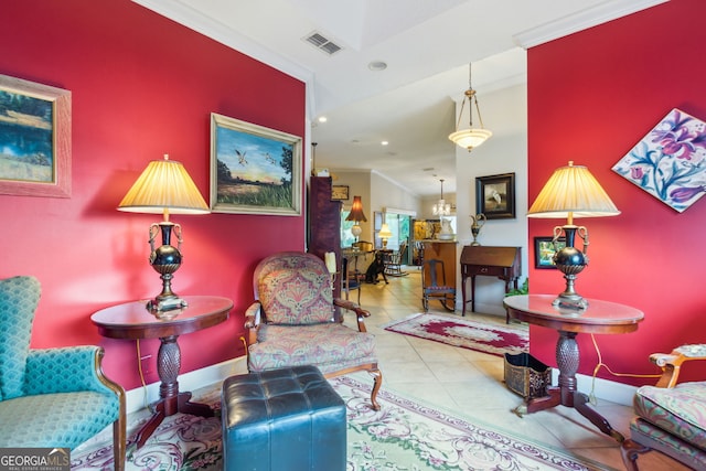 sitting room with tile flooring and crown molding