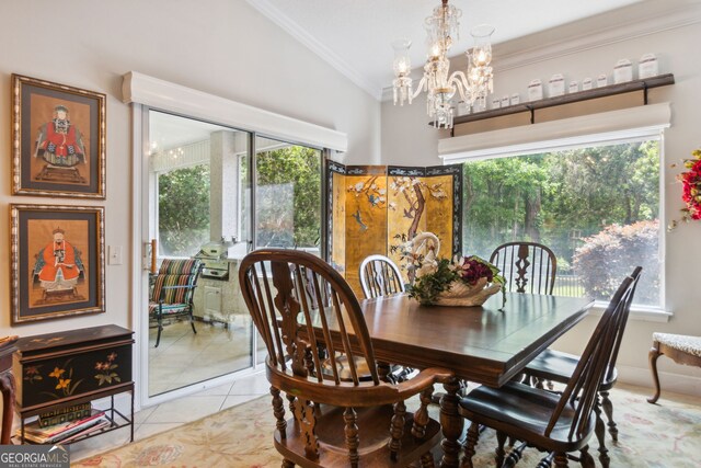 tiled dining area featuring a chandelier and lofted ceiling