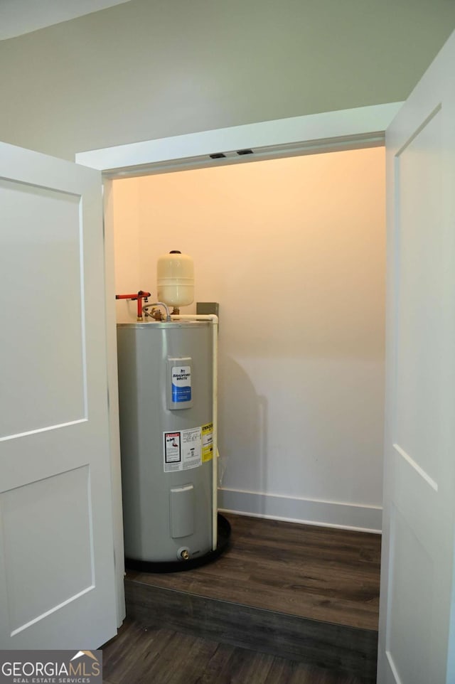 utility room with water heater