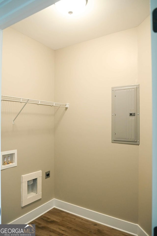 washroom featuring dark hardwood / wood-style flooring, hookup for an electric dryer, and washer hookup