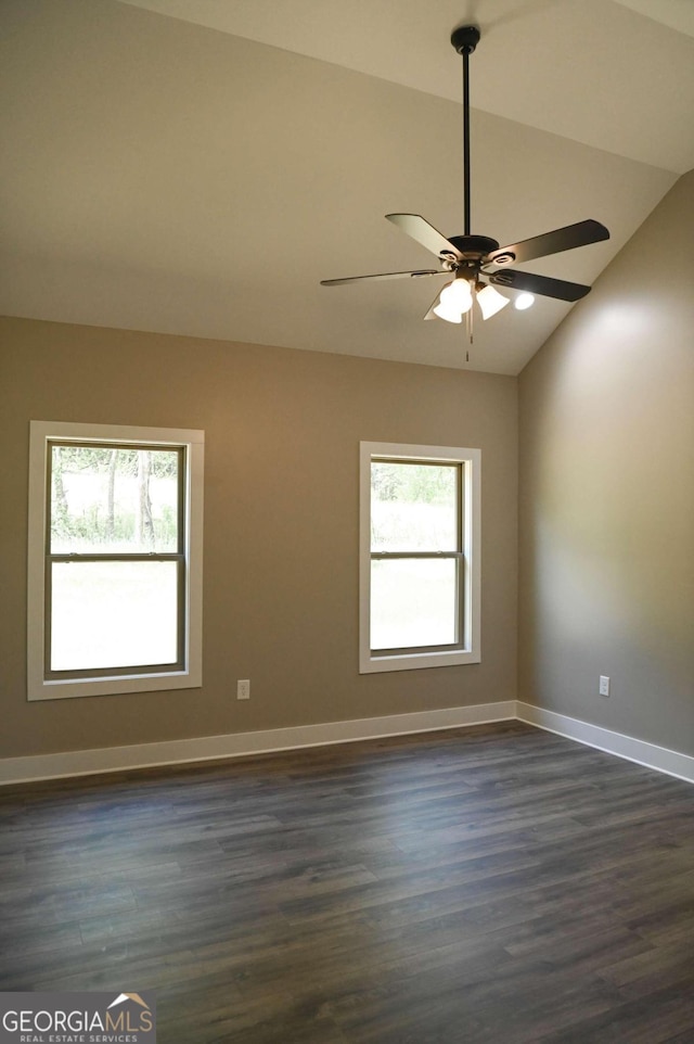 spare room featuring ceiling fan, dark hardwood / wood-style floors, and lofted ceiling