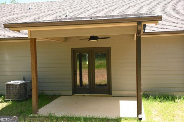 property entrance featuring a patio, ceiling fan, french doors, and central air condition unit