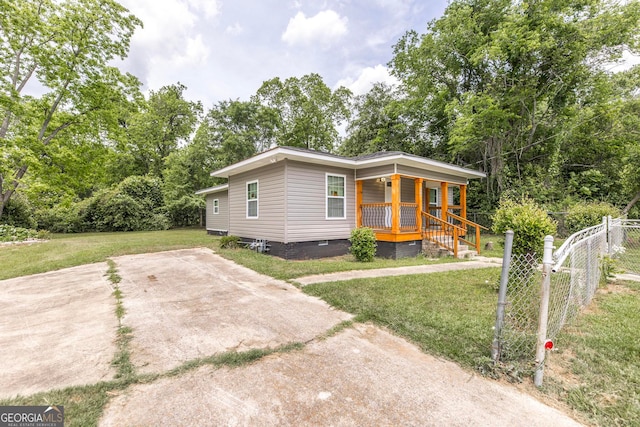 view of front of house with a porch and a front yard