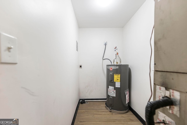 utility room featuring electric water heater