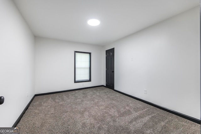 empty room with carpet flooring