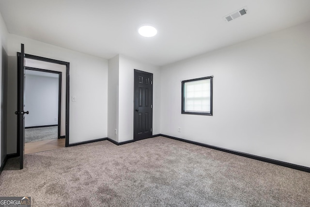 unfurnished bedroom featuring carpet flooring