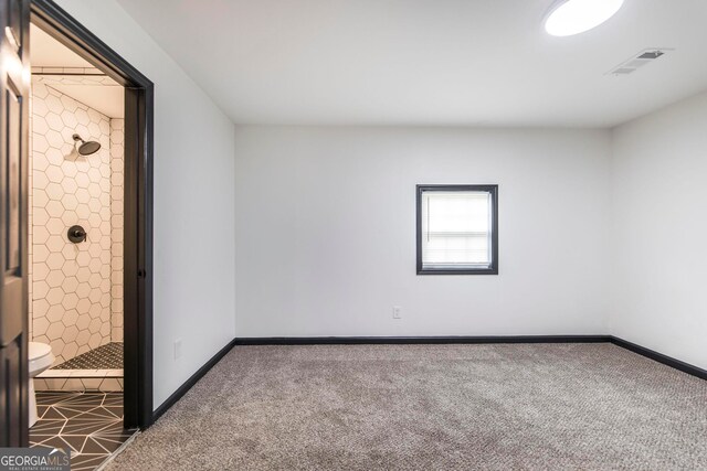 unfurnished room featuring carpet flooring