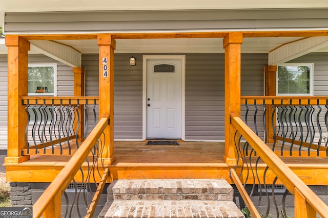 view of exterior entry featuring a porch