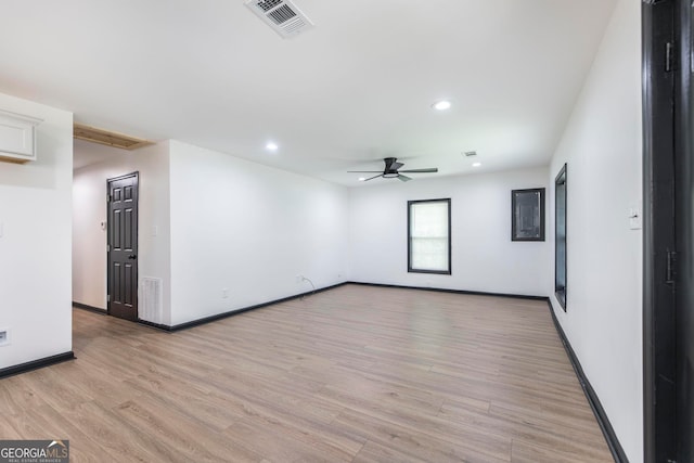 empty room with light hardwood / wood-style flooring and ceiling fan