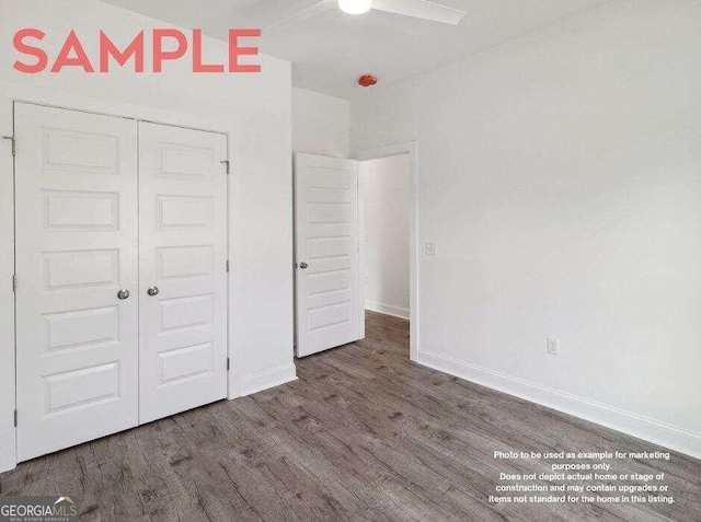 unfurnished bedroom with a closet, ceiling fan, and dark hardwood / wood-style floors