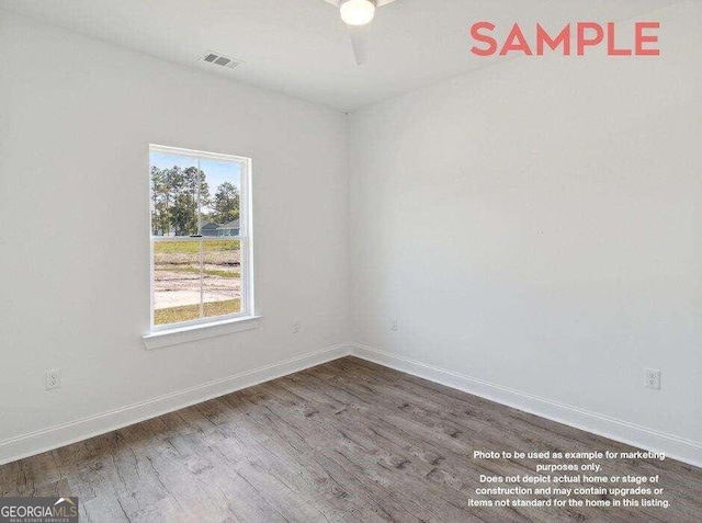 empty room with dark hardwood / wood-style floors