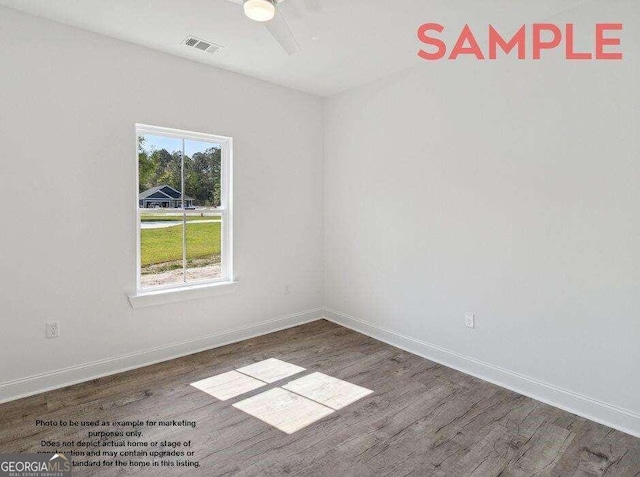 spare room featuring dark hardwood / wood-style flooring