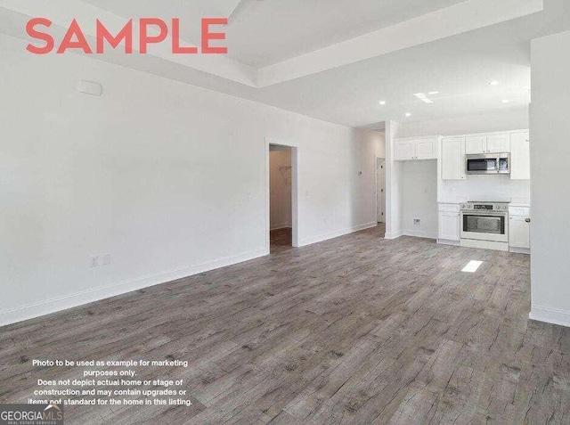 unfurnished living room featuring hardwood / wood-style floors