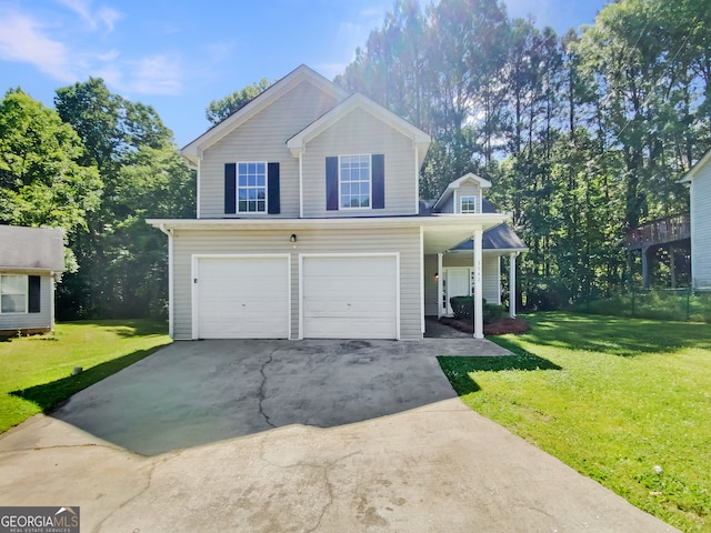 view of property featuring a garage, a front lawn, and a porch