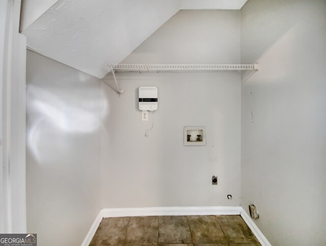 clothes washing area with hookup for an electric dryer, tile floors, and hookup for a washing machine