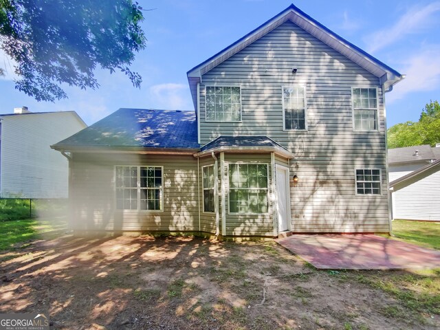 rear view of property with a patio