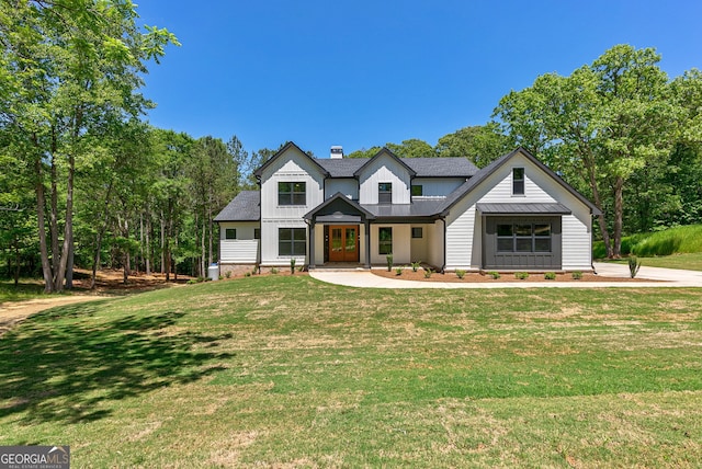 modern inspired farmhouse featuring a front lawn