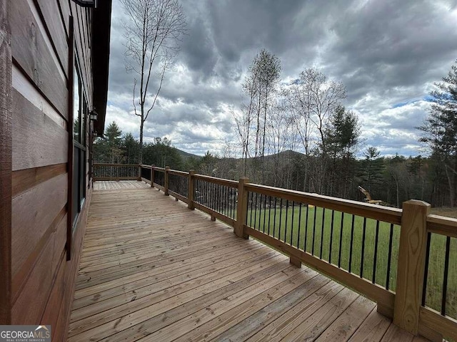 deck featuring a lawn