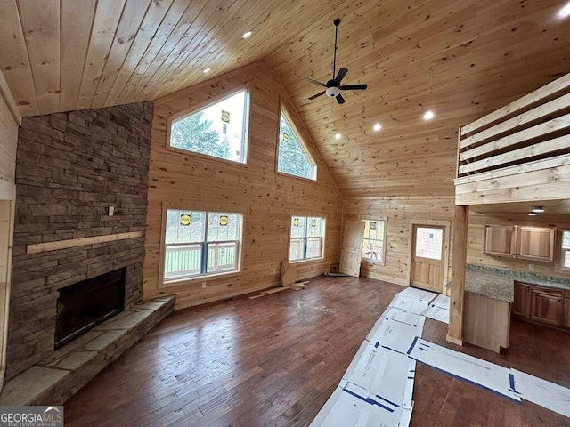 interior space featuring high vaulted ceiling, wooden walls, hardwood / wood-style flooring, and wood ceiling