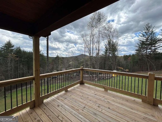 wooden terrace with a yard