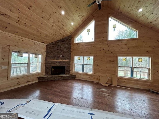 unfurnished living room with a healthy amount of sunlight and wood-type flooring