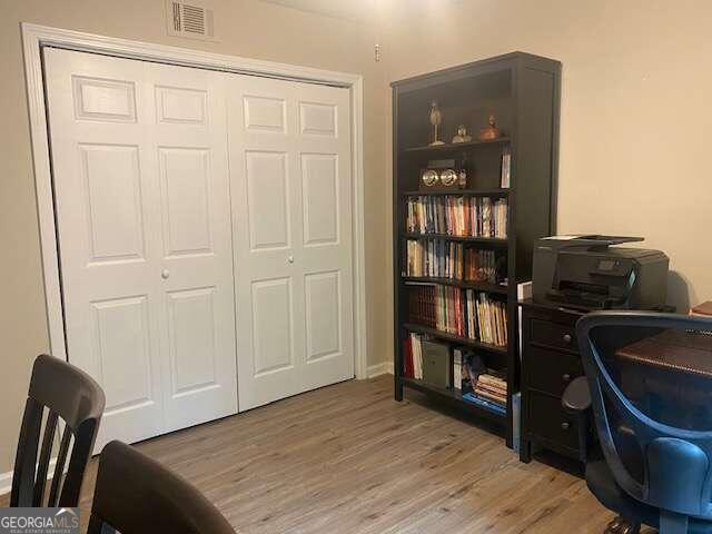 office area with wood-type flooring