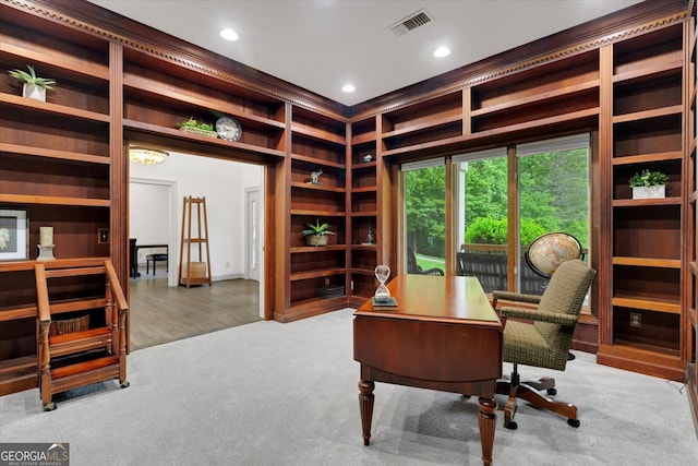 office with built in features and wood-type flooring