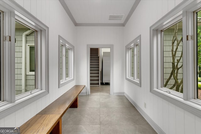 hallway featuring light tile floors