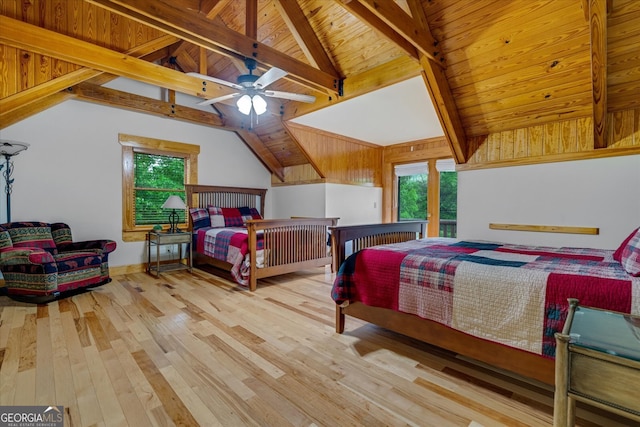 bedroom with ceiling fan, vaulted ceiling with beams, hardwood / wood-style floors, and wooden ceiling