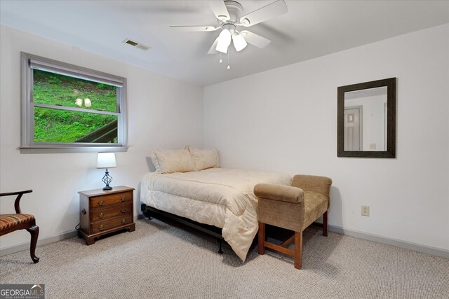 carpeted bedroom featuring ceiling fan