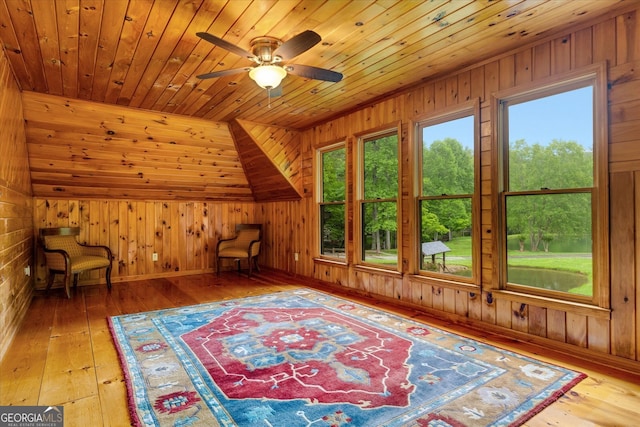 sitting room featuring wooden ceiling, vaulted ceiling, and wood-type flooring