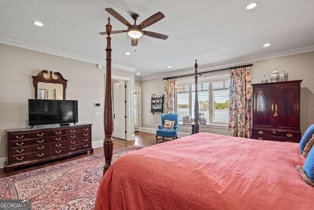 bedroom featuring ceiling fan, hardwood / wood-style floors, and ornamental molding