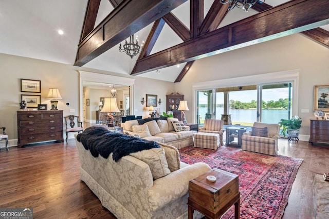 living room with an inviting chandelier, a water view, dark hardwood / wood-style floors, high vaulted ceiling, and beam ceiling