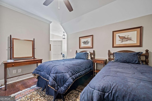 bedroom with lofted ceiling, hardwood / wood-style flooring, ceiling fan, and ornamental molding