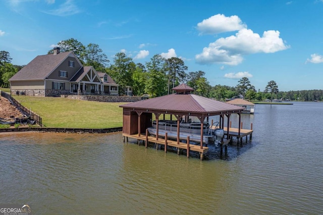 view of dock featuring a lawn and a water view